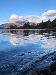 body of water near mountains