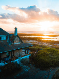 aerial photo of house near calm body of water