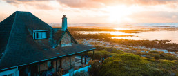 aerial photo of house near calm body of water
